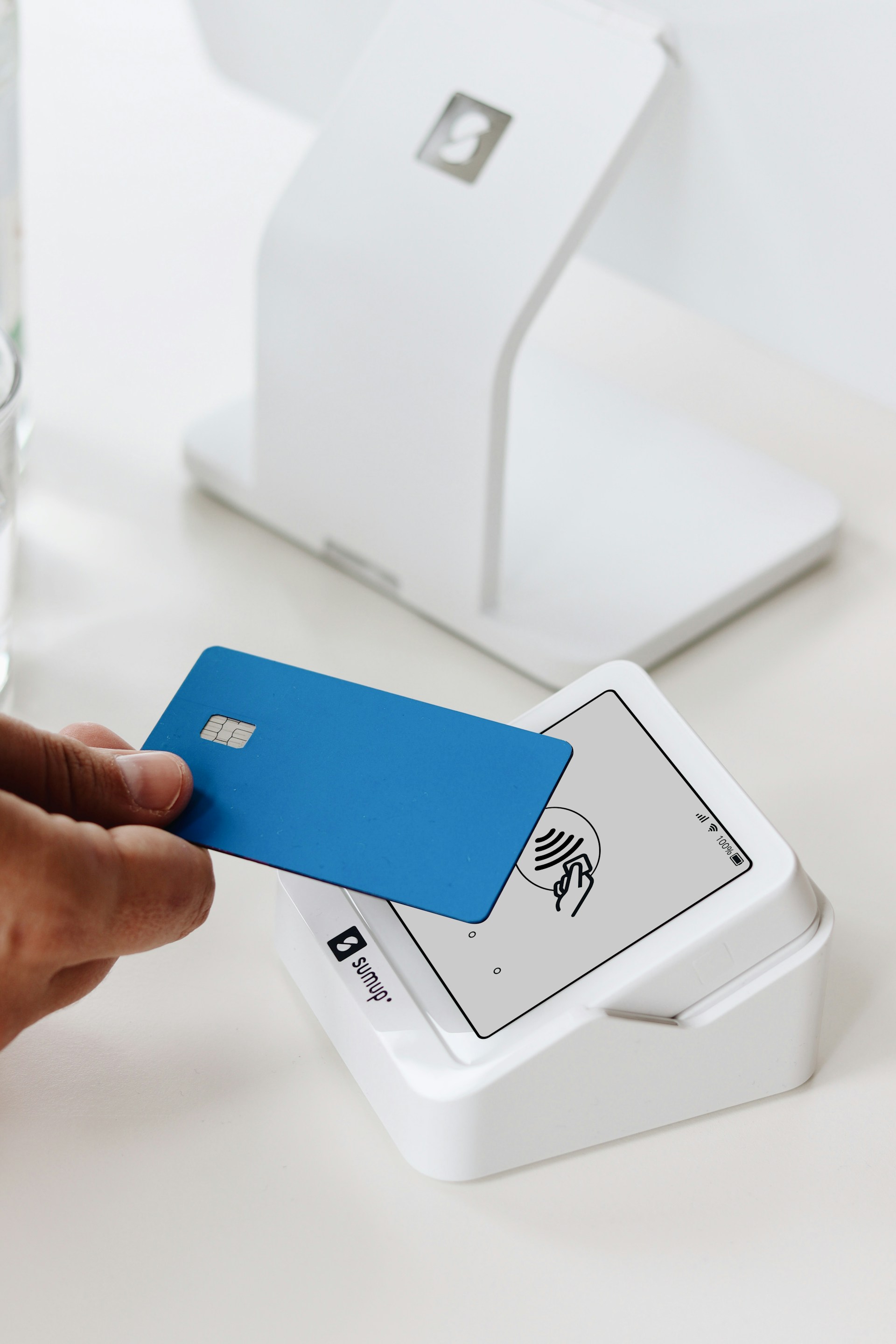 person making a contactless payment with a card